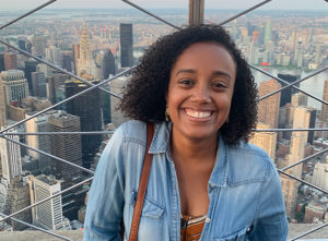 Jessica Poitevien, a Haitian-American writer (smiling black woman against a cityscape – probably New York)